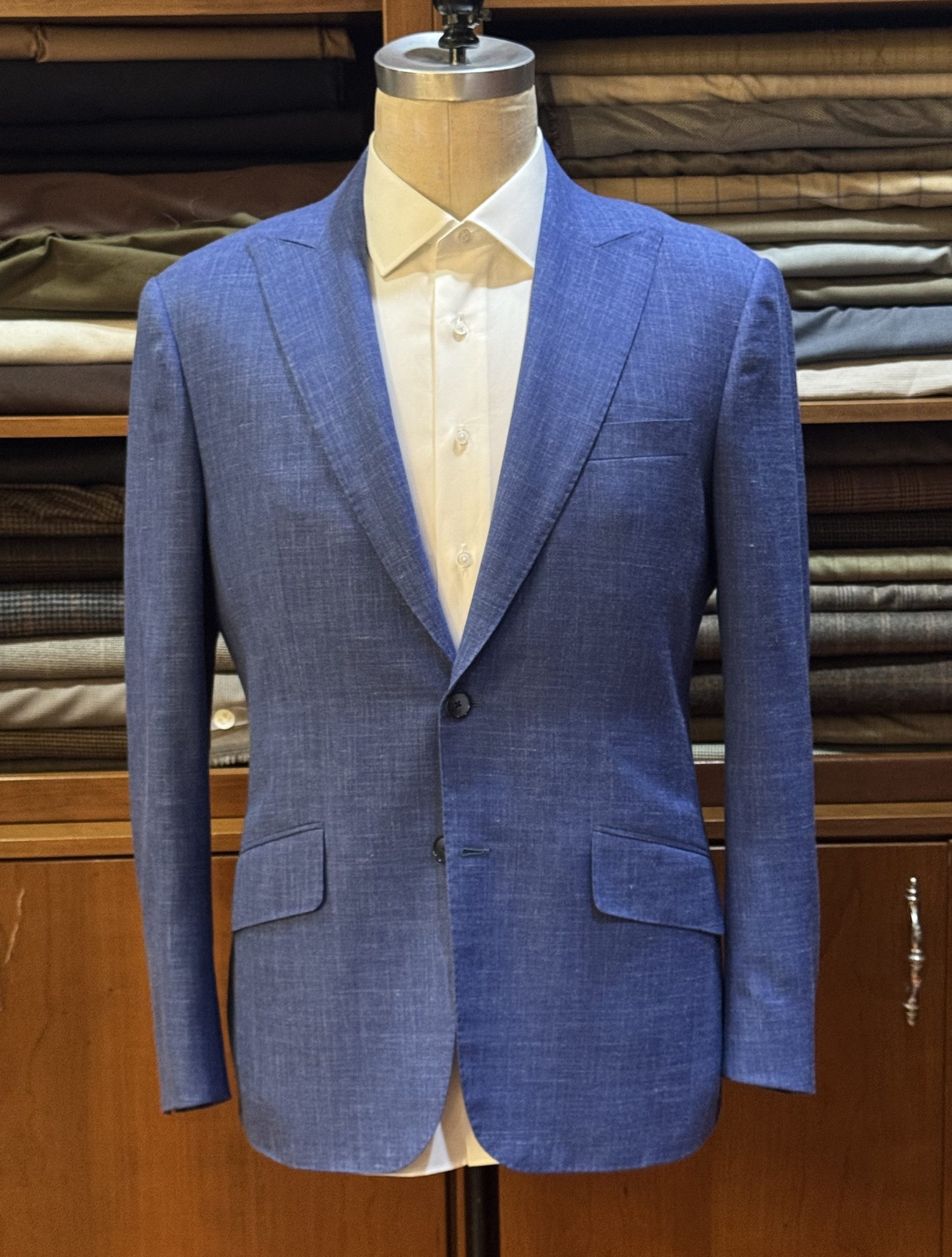 A bespoke summer suit made by Bhambi's with wool, silk, and linen blend fabric to wear to a summer wedding