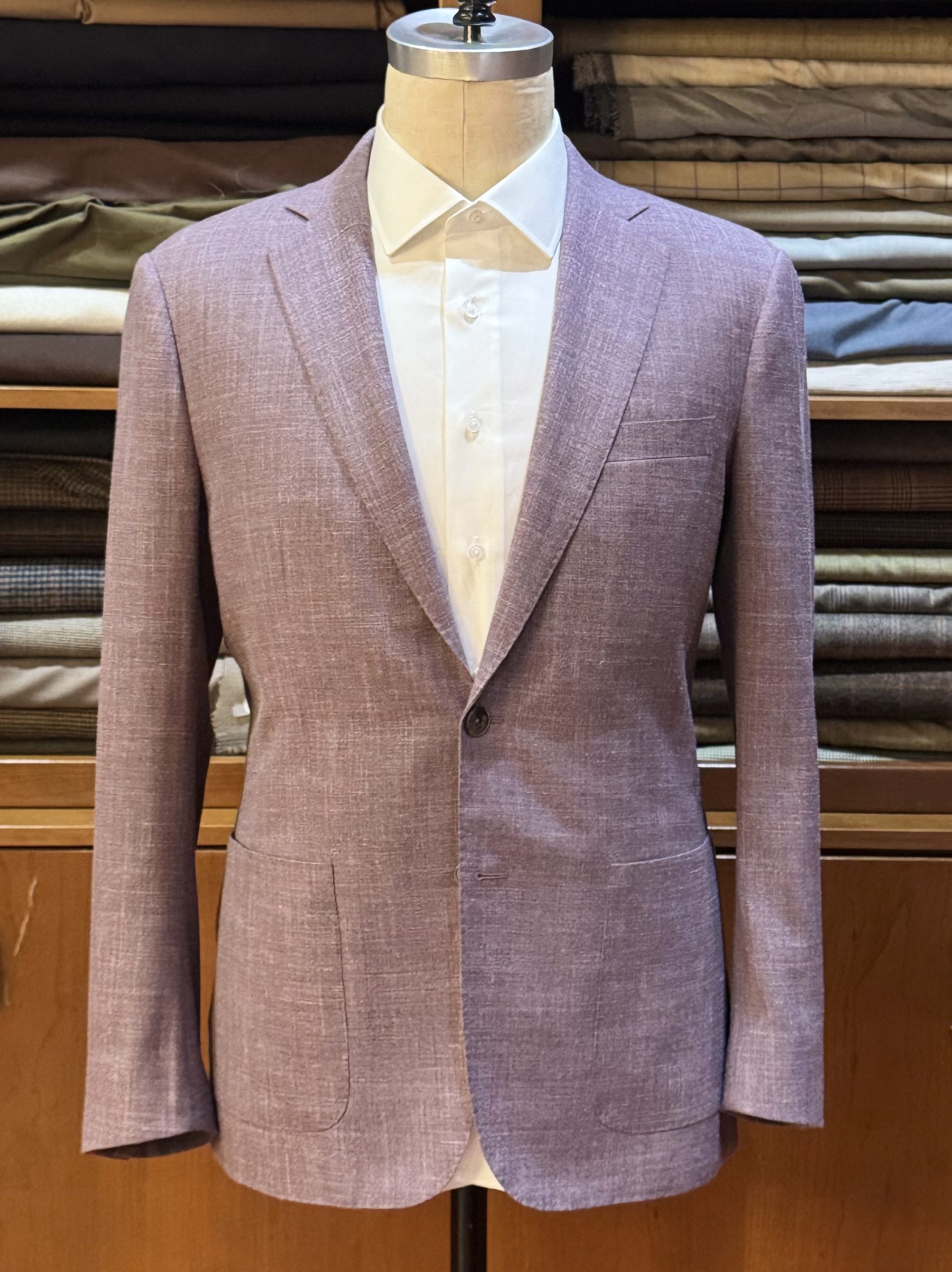 a light purple bespoke summer suit made with Loro Piana's wool, silk, and linen blend fabric . Wear to a summer wedding 