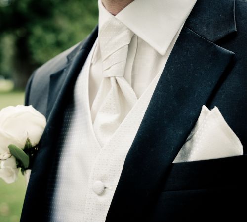 Custom vest detailing at Bhambi's NYC – bespoke waistcoat with personalized lining, lapels, and hand-stitched buttons