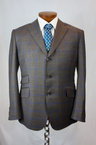 Bhambi's master tailor hand-sewing a bespoke suit in the New York City workshop – custom menswear crafted in Midtown Manhattan