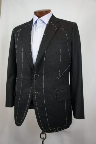 Bhambi's master tailor hand-sewing a bespoke suit in the New York City workshop – custom menswear crafted in Midtown Manhattan