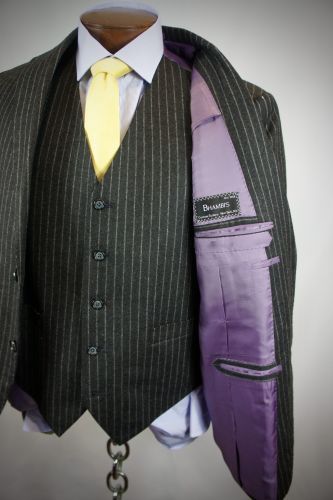 Bhambi's master tailor hand-sewing a bespoke suit in the New York City workshop – custom menswear crafted in Midtown Manhattan