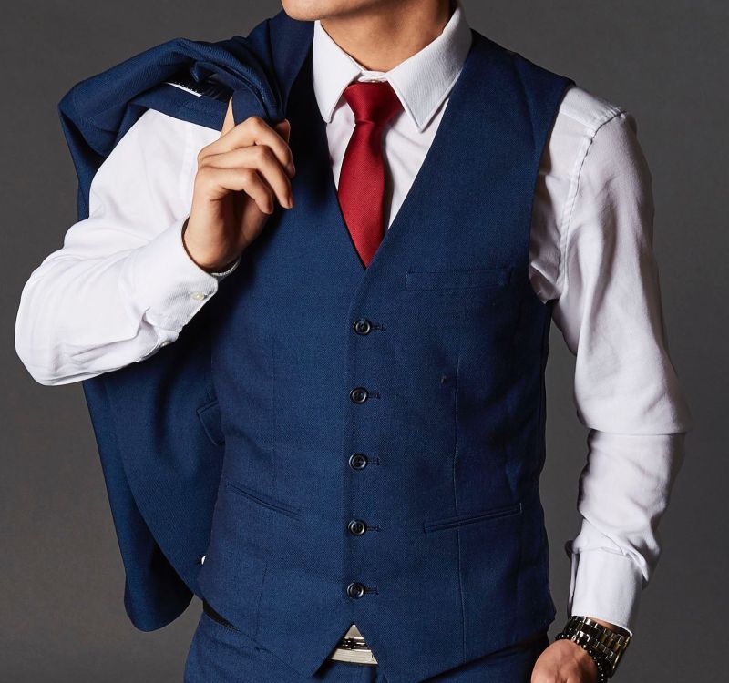 Custom vest detailing at Bhambi's NYC – bespoke waistcoat with personalized lining, lapels, and hand-stitched buttons